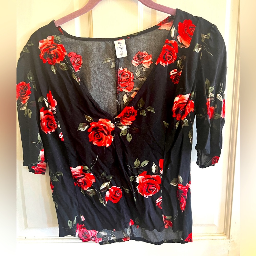 Floral vneck blouse with red roses on black background